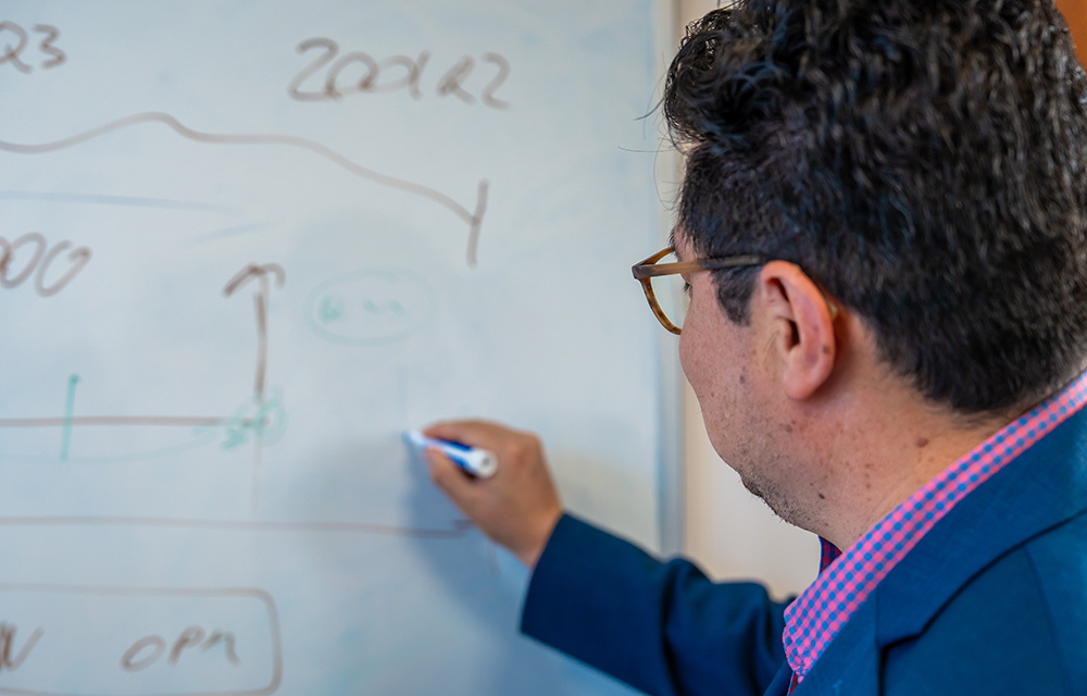 Man writing on whiteboard