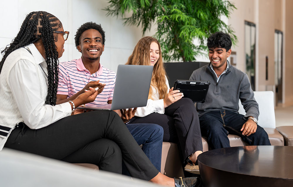 Four interns sitting and talking