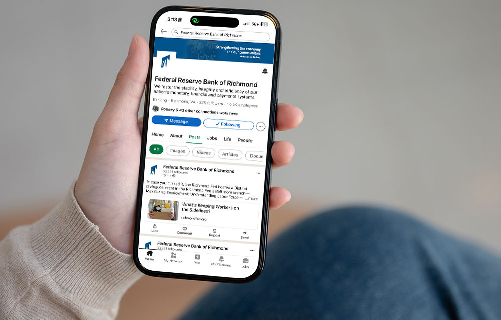 An iPhone screen with Federal Reserve Bank of Richmond LinkedIn account