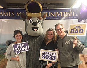 Family celebrating their child at college