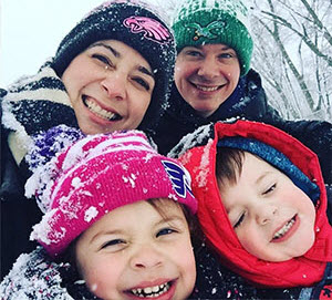Family enjoying the snow together