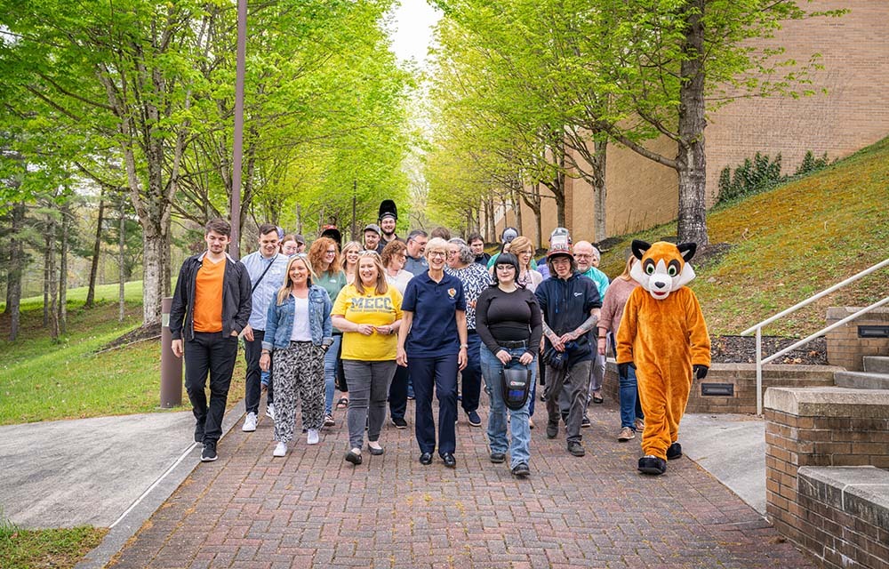 Faculty and students at Mountain Empire Community College walking on campus.