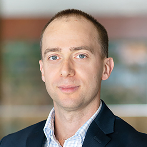 Headshot of Alisdair Mckay.