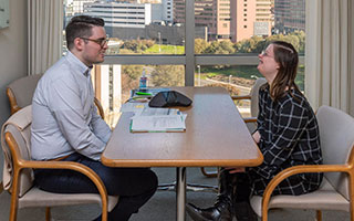 an interview scene by a window