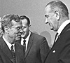 President Johnson (right) shakes hands with William McChesney Martin (left), chairman of the Federal Reserve Board