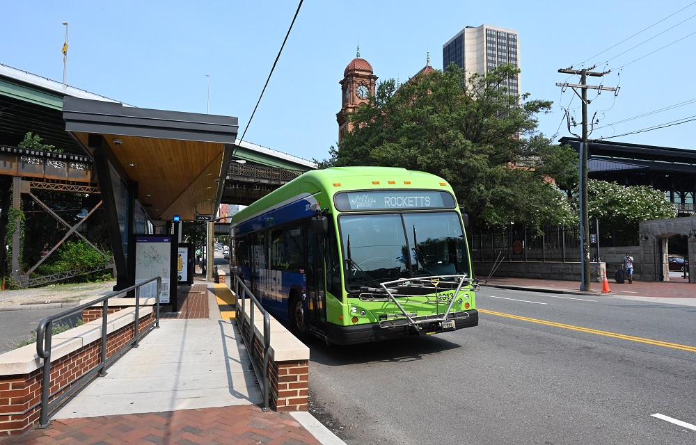 Image of transit bus waiting at stop.