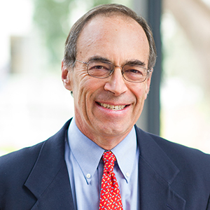 Headshot photo of Alan Auerbach smiling.