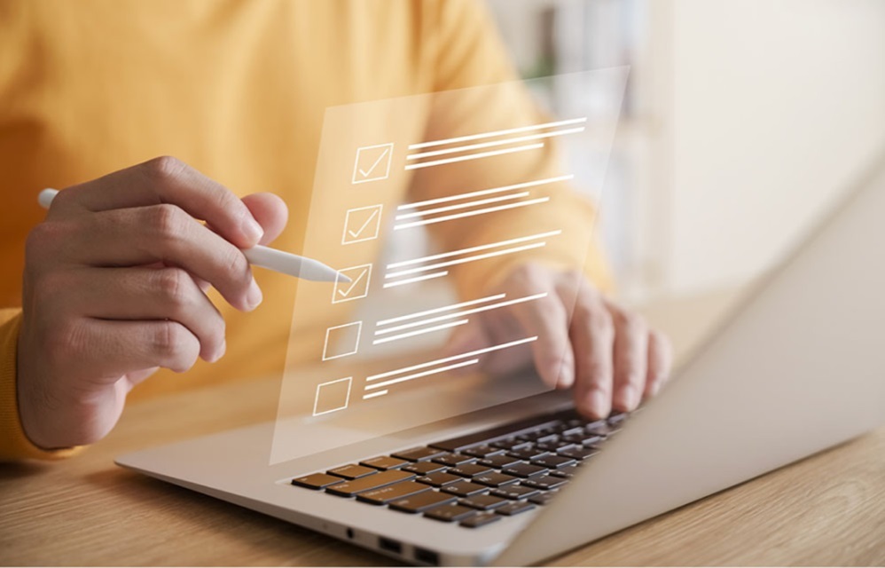 Person using a stylus to check off a virtual checkbox.