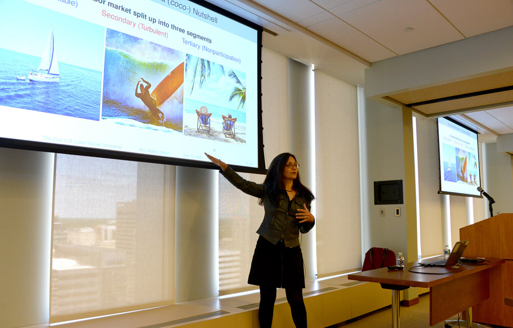 Ayşegül Şahin presenting the paper “The Dual U.S. Labor Market Uncovered.”