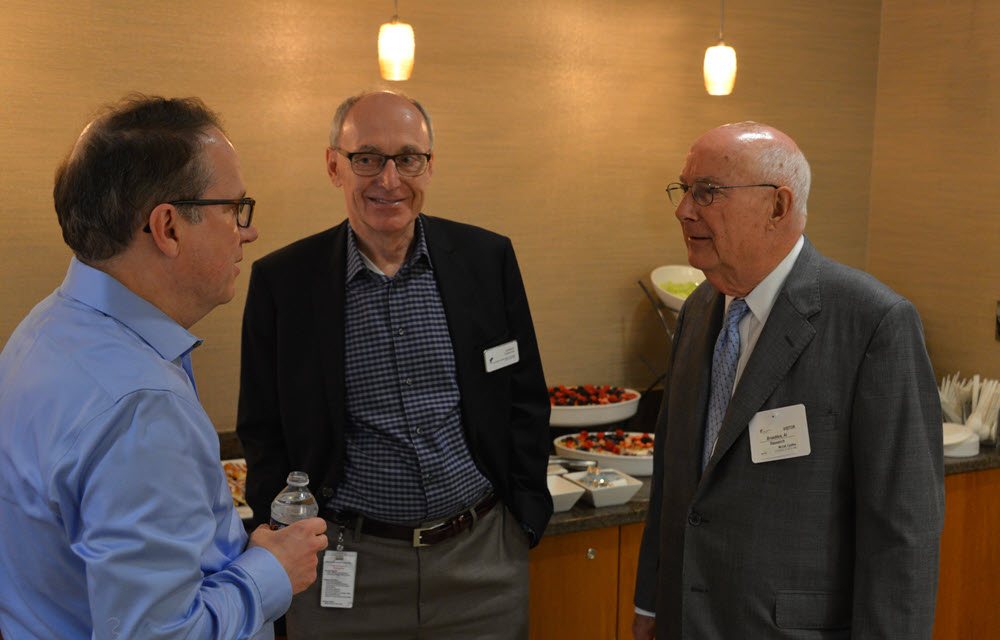 Economists reflecting on the conference seminars. 