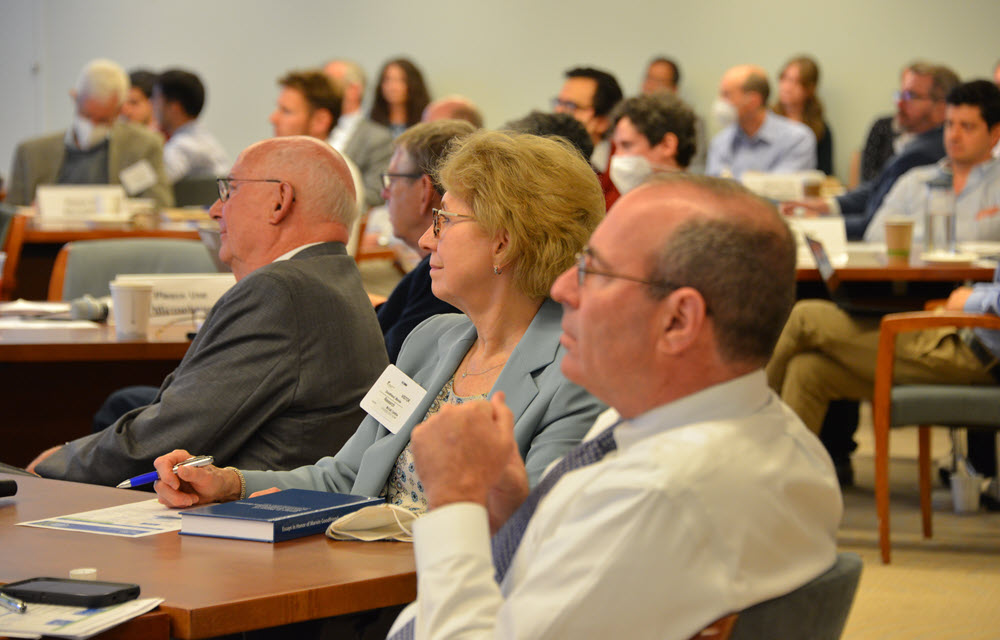 Marsha Goodfriend, Al Broaddus and Tom Barkin actively engaged during a conference seminar. 