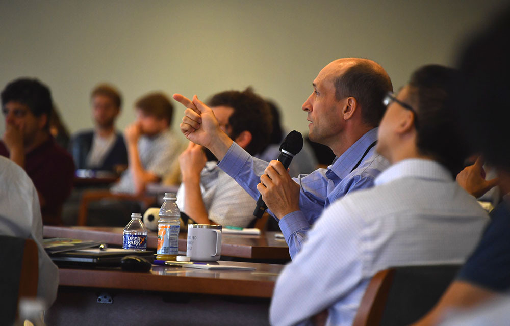 Questions and discussions during seminars to advance economic research