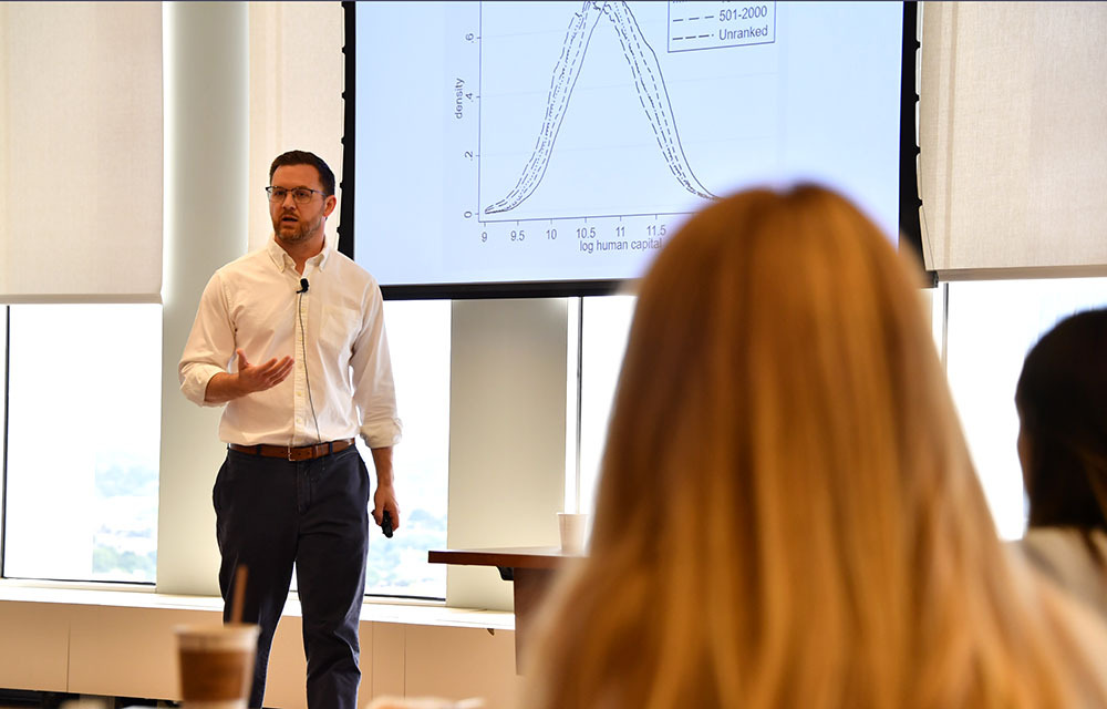 Todd Schoellman presenting the paper “The Global Distribution of College Graduate Quality”