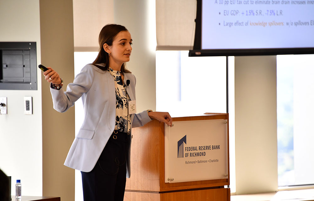 Marta Prato presenting the paper “The Global Race for Talent: Brain Drain, Knowledge Transfer, and Growth”