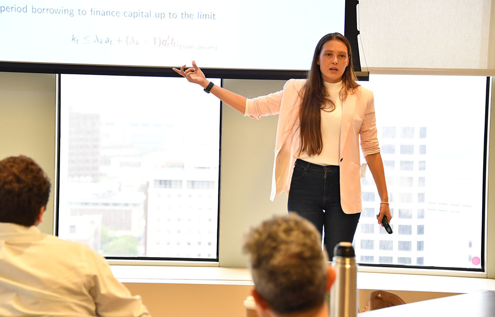 Kristina Manysheva presenting the paper “Land Property Rights, Financial Frictions and Resource Allocation in Developing Countries”