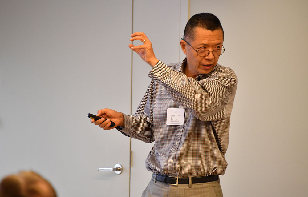 Tao Zha presenting the paper “The S-curve: Understanding the Dynamics of Worldwide Financial Liberalization”