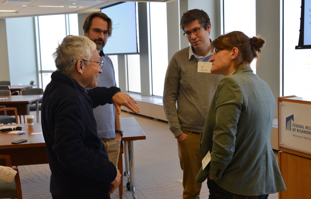 Economists’ collaborating between seminars. 