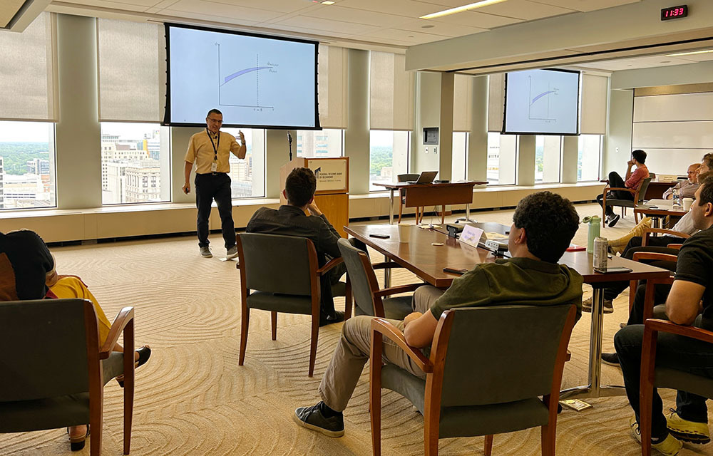 Mark Bils presenting “The Quality-Adjusted Cyclical Price of Labor”, joint with Marianna Kudlyak and Paulo Lins.