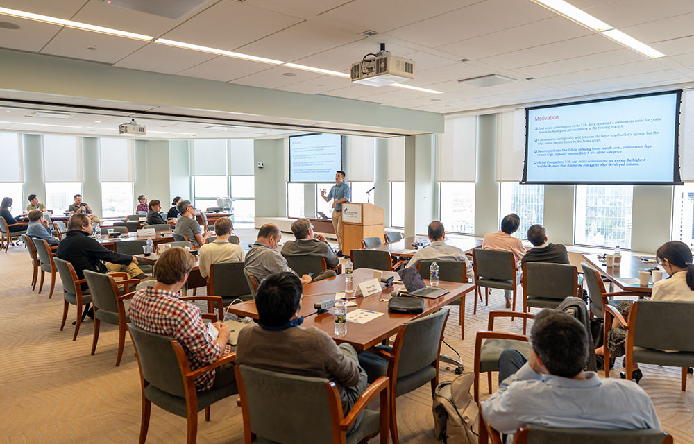 Greg Buchak presenting his paper to an audience during CORE Week.