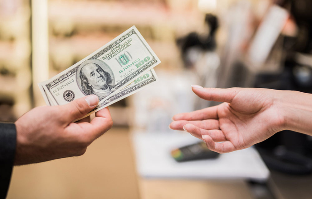 handing person cash