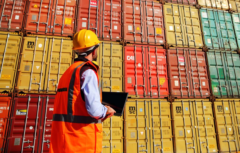 Workers reviewing Containers