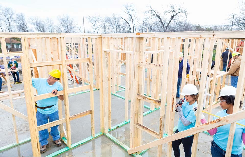 People constructing house