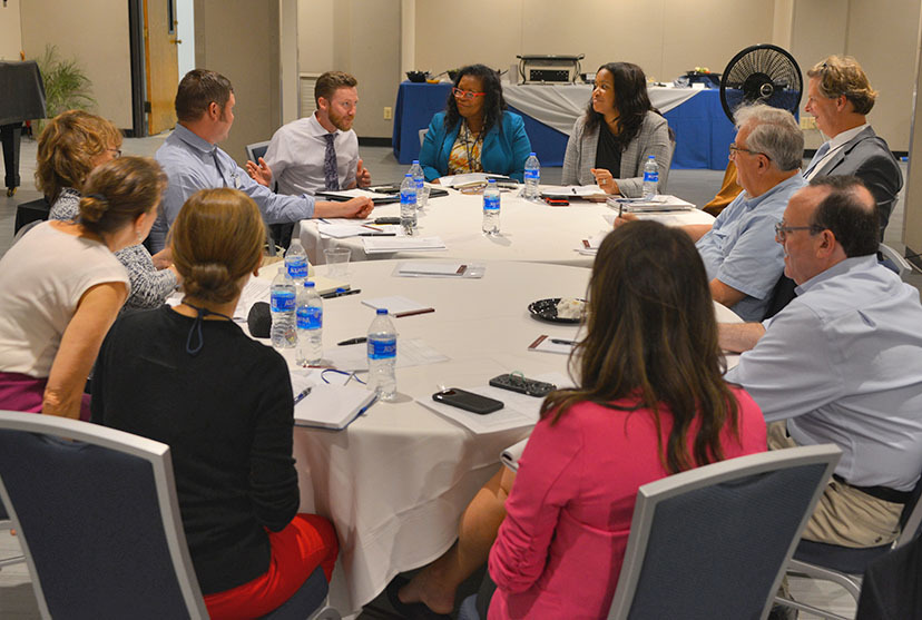 People talking at a round table