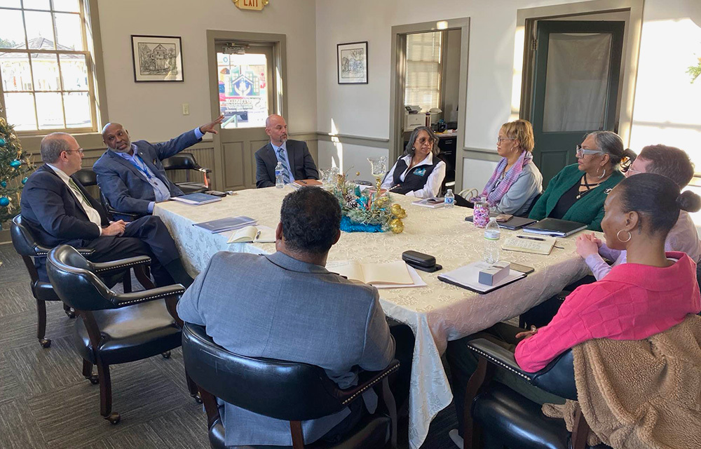 President Tom Barkin sits with others to discuss at the roundtable