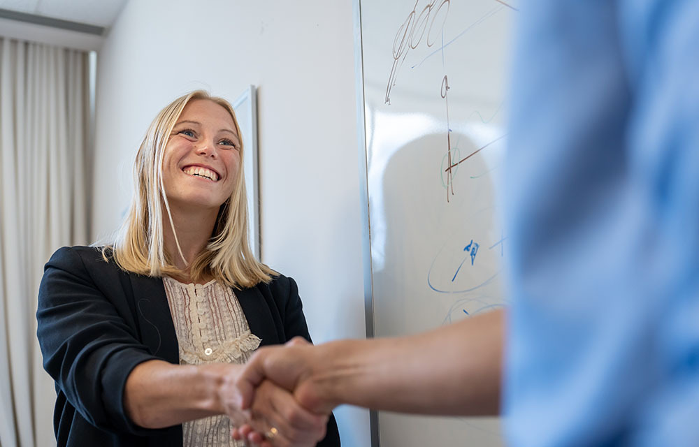 Woman shaking hand