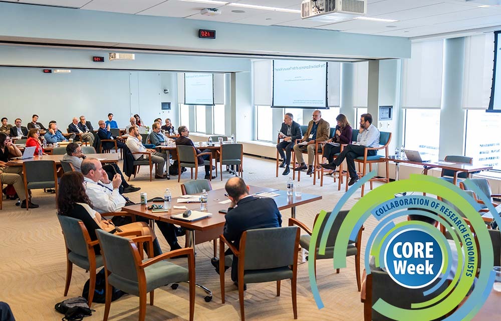 A panel of speakers presenting their paper to a crowd at CORE Week.