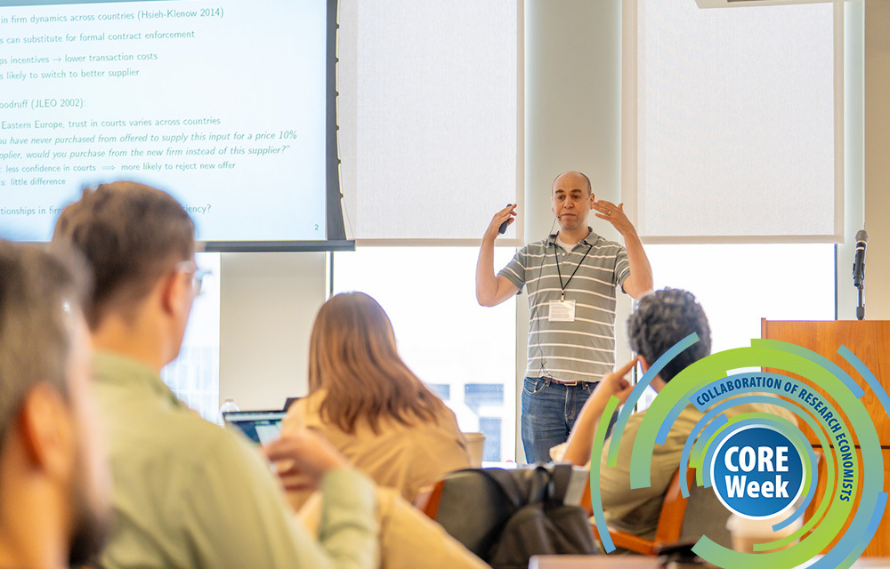 A speaker presenting his paper to fellow economists at CORE Week.