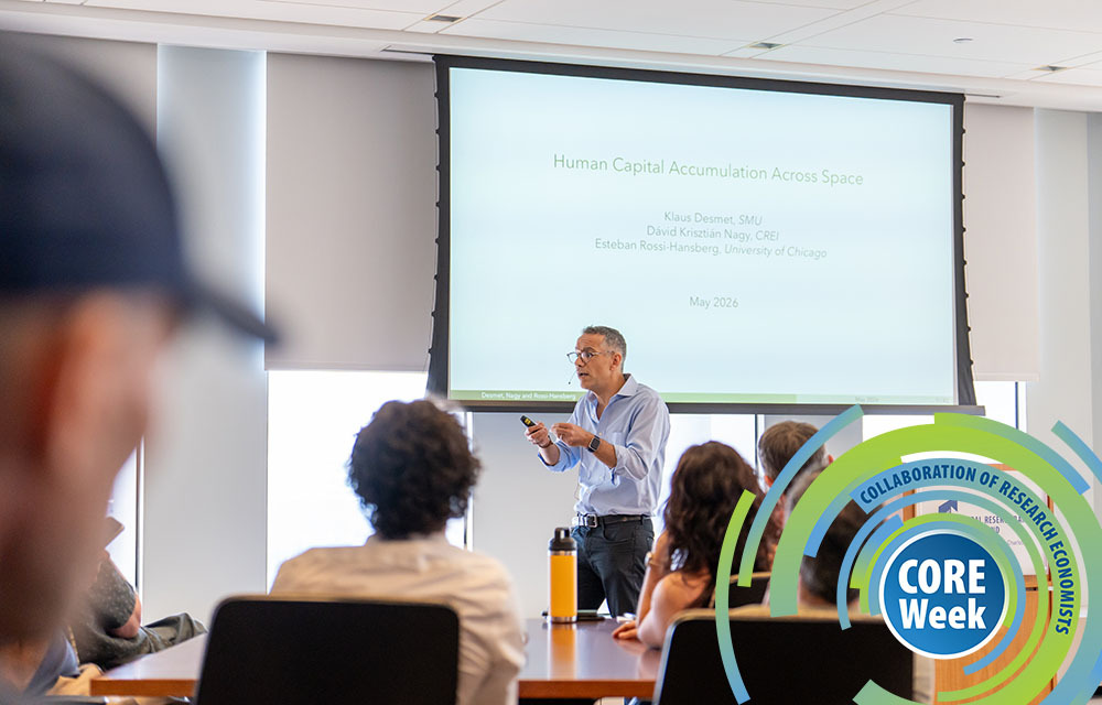 Economist presenting his research at the CORE Week conference.