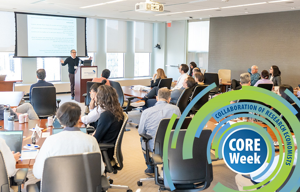 CORE week speaker presenting his paper to a crowd.