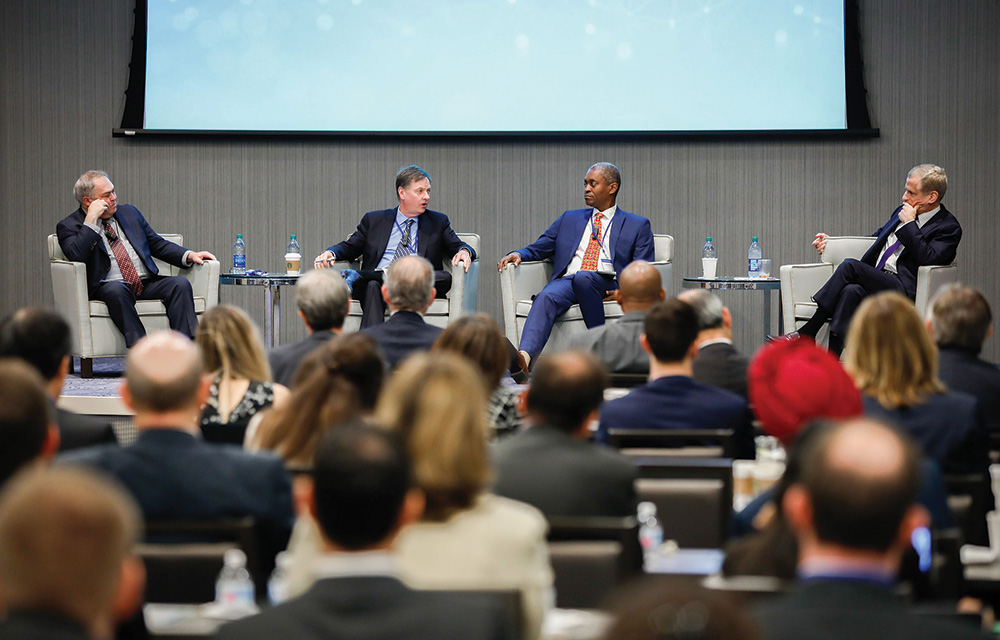 A panel of 4 speakers discussing at the 2019 Technology Enabled Disruption conference