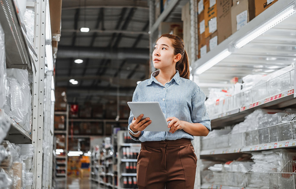 a woman in a warehouse working