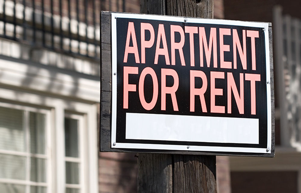 apartment for rent sign in rural downtown