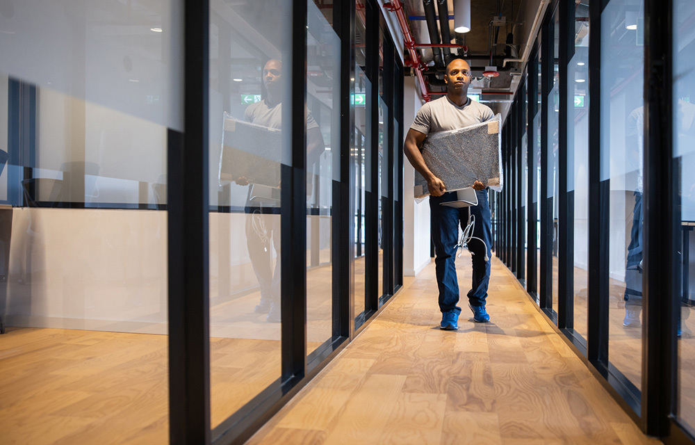 Man carrying stuff out of office