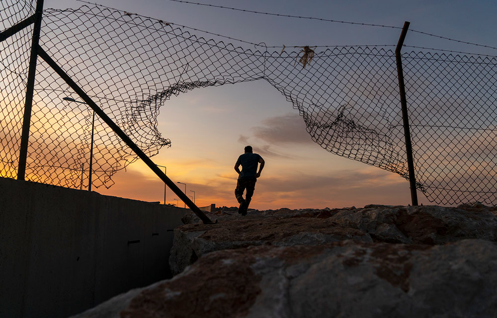 running through an opening in the fence