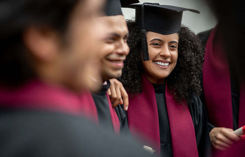 young graduates smiling