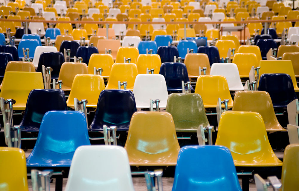 a whole bunch of empty plastic chairs