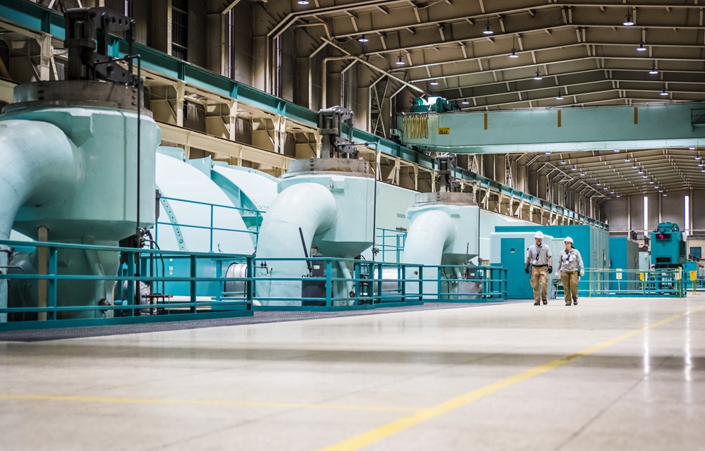 Workers walking through turbine room at Oconee Nuclear Station.