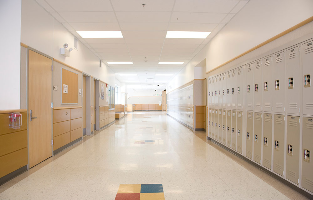 Lockers in an empty high school hallway