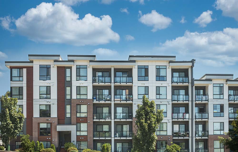 Side-view of an apartment building on a sunny day.