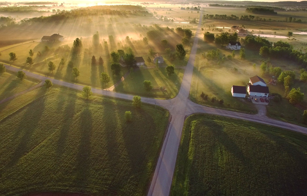 sun over a farm