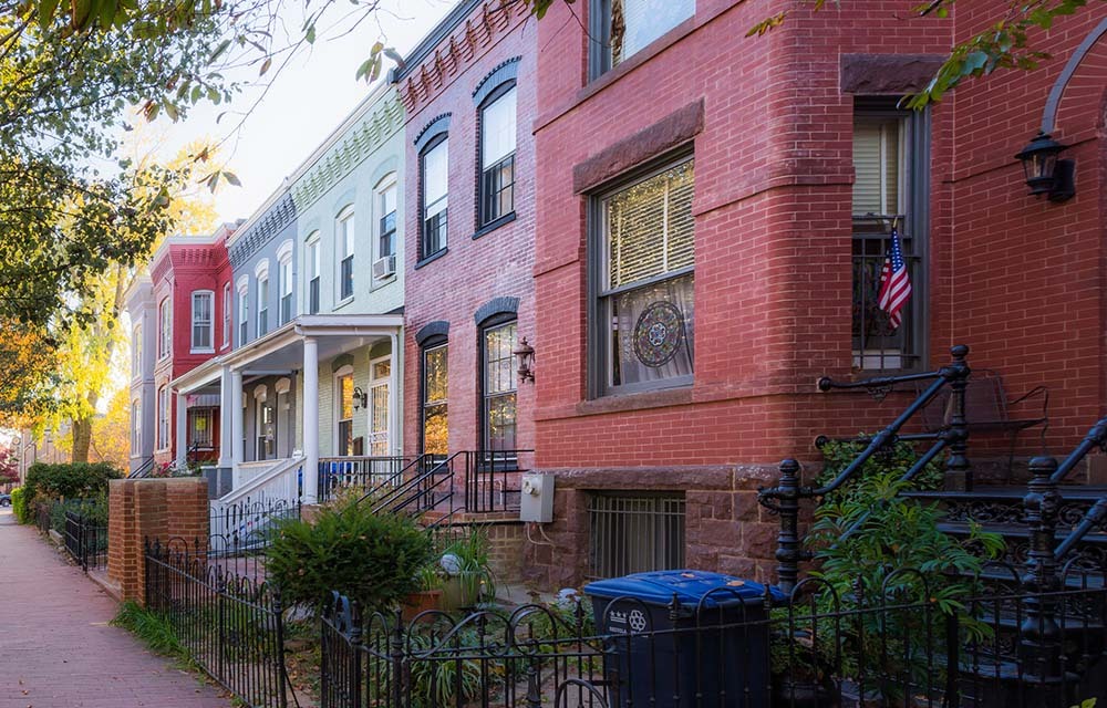 A line of colorful, brick townhouses in Washington, D.C.