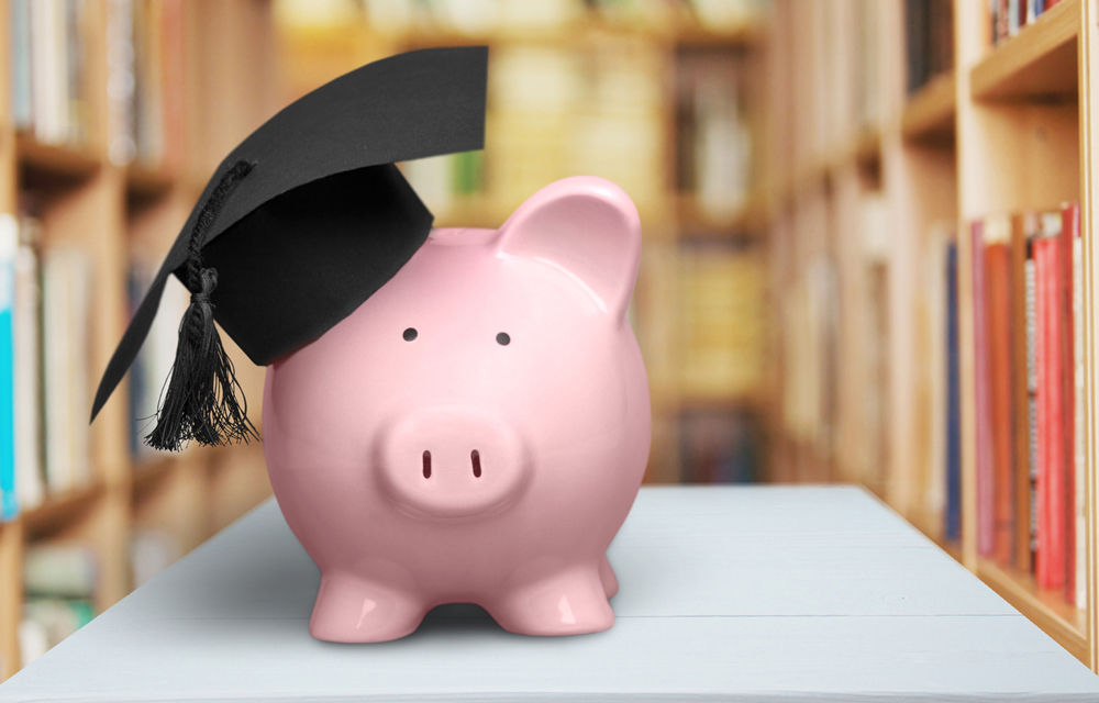 photo of a piggy bank with a graduation cap