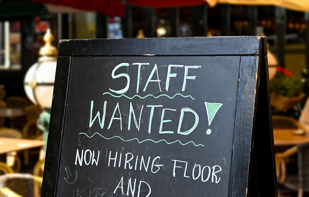 Staff wanted sign written in chalk outside of restaurant.