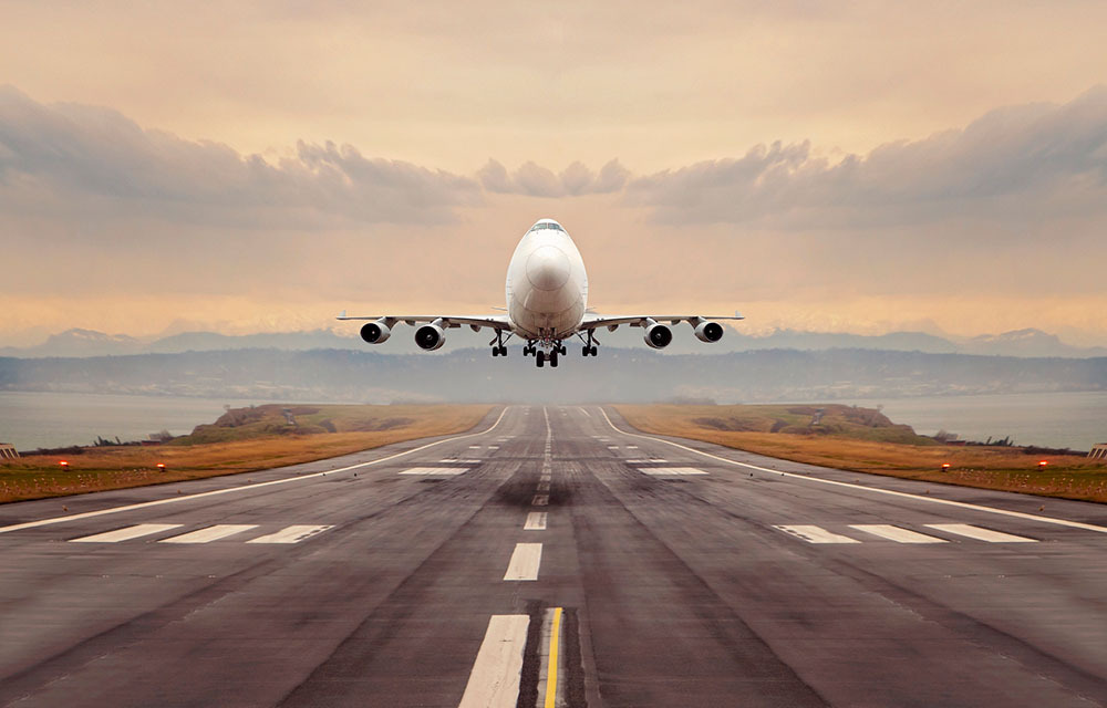 A large cargo airplane above a runway