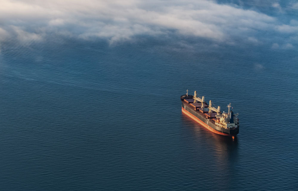 Large cargo ship in the open ocean.