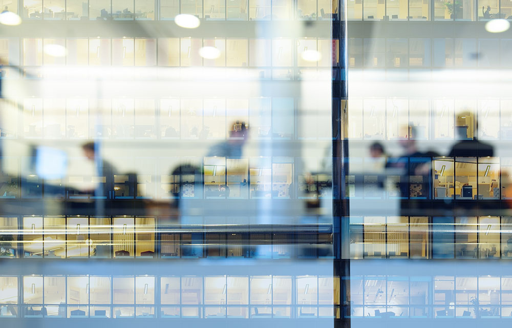 Reflections of people on a building window